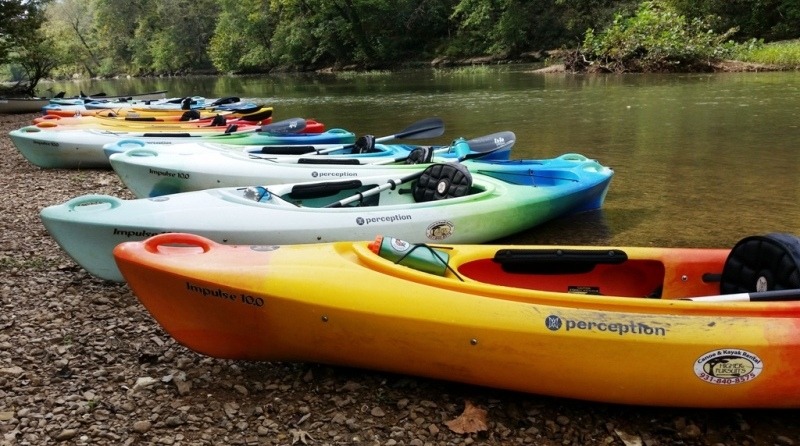 rental kayaks on a gravel bar on the river